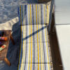 foldable sunbed cushion on chaise lounge