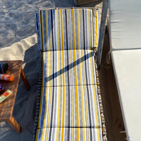 foldable sunbed cushion on chaise lounge