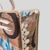 sun lounge cushion and beach bag convertible beach bag in beach pattern close view