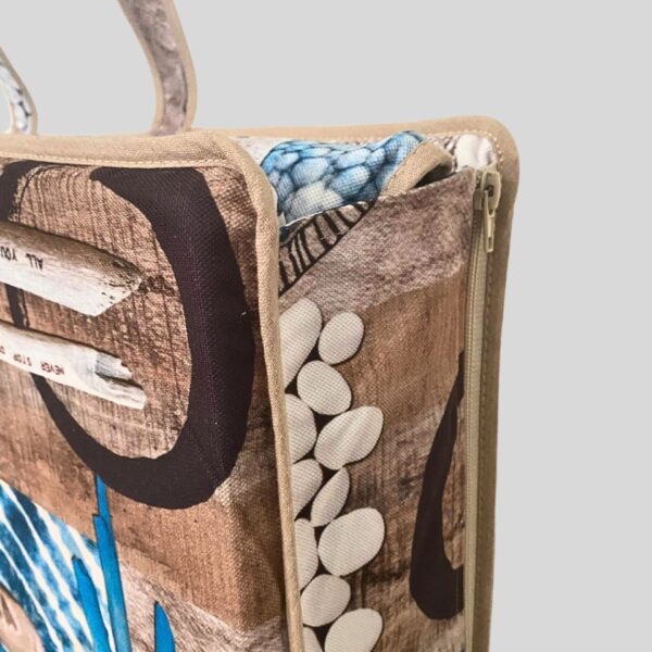 sun lounge cushion and beach bag convertible beach bag in beach pattern close view