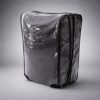 Transparent PVC suitcase cover shown at angle with zippered closure and handle openings