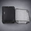 Transparent PVC luggage cover used as dust protection for suitcase in storage
