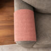 Close-up of tan sofa armrest overlay with soft textured fabric