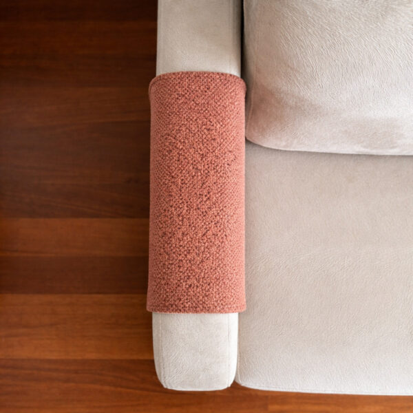 Tan armrest cover adding cozy detail to living room sofa