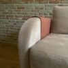 Modern sofa armrest with tan decorative overlay protector