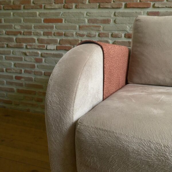 Modern sofa armrest with tan decorative overlay protector
