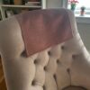 Tan sofa headrest cover styled on cozy living room couch