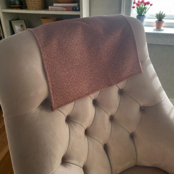 Tan sofa headrest cover styled on cozy living room couch