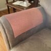 Soft fleece armrest cover protecting sofa from daily wear