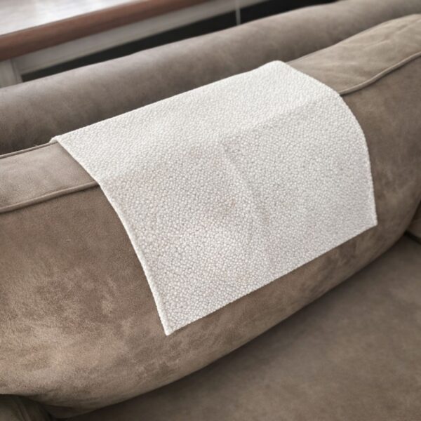 paw-friendly-fabric-sofa-cover-offwhite (8) Wear resistant sofa headrest cover on three-seater sofa in elegant living room