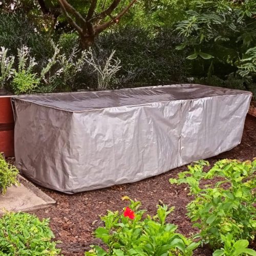 Gray tarpaulin furniture set cover